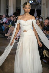 Elegant White Off-Shoulder Gown with Chiffon Drape and Modern Cut-Out Detail