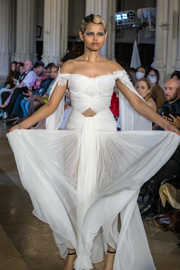 Elegant White Off-Shoulder Gown with Chiffon Drape and Modern Cut-Out Detail