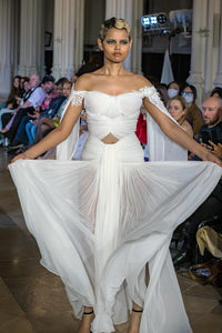 Elegant White Off-Shoulder Gown with Chiffon Drape and Modern Cut-Out Detail