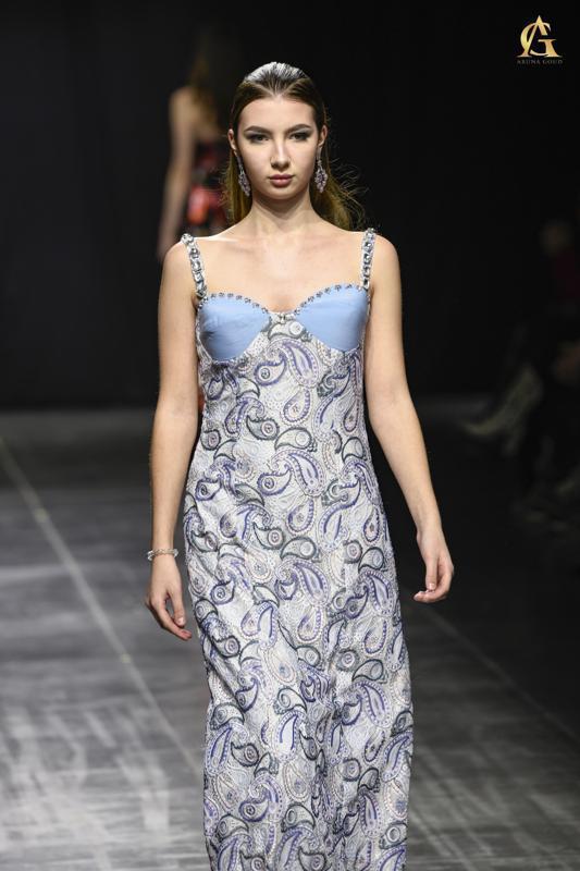 Elegant Blue and White Floral Dress with Playful Ruffle and Flattering Fit