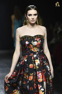 Elegant Black Strapless Dress Featuring Bold Floral Patterns and Flared Skirt