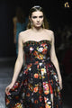 Elegant Black Strapless Dress Featuring Bold Floral Patterns and Flared Skirt