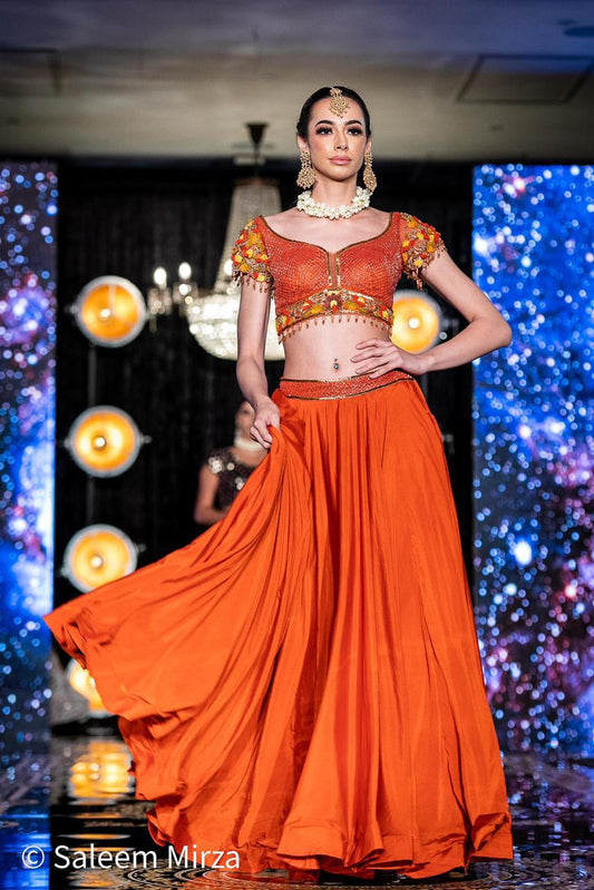 Vibrant Orange Silk Lehenga Choli Set with Detailed Embroidery