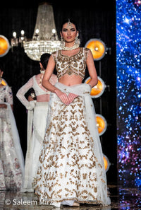 Luxurious White Lehenga with Golden Embroidered Blouse and Skirt